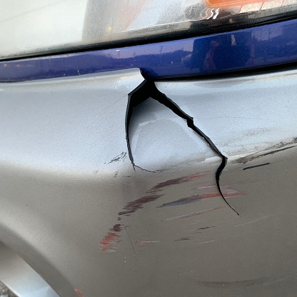 Automobile front fender damaged.