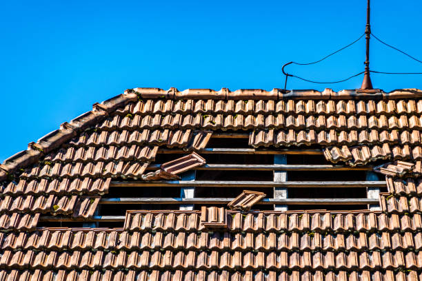 damaged roof at an old house stock photo