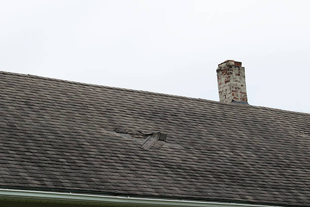 Damaged Roof Shingles stock photo