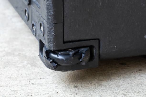 Damaged rubber bearing luggage wheel Close up cracked damaged broken expired ruined torn rubber bearing hardcase suitcase luggage wheel need replacement to repair or fix problem broken suitcase stock pictures, royalty-free photos & images