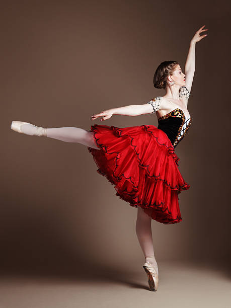 Dancing ballerina Professional ballerina standing en pointe in arabesque. Role of Kitri, "Don Quixote" ballet. arabesque position stock pictures, royalty-free photos & images