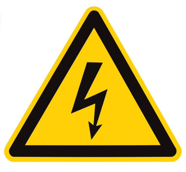 Danger Electrical Hazard High Voltage Sign Isolated Macro Danger Electrical Hazard High Voltage Sign Isolated, black triangle over yellow, large macro high voltage sign stock pictures, royalty-free photos & images