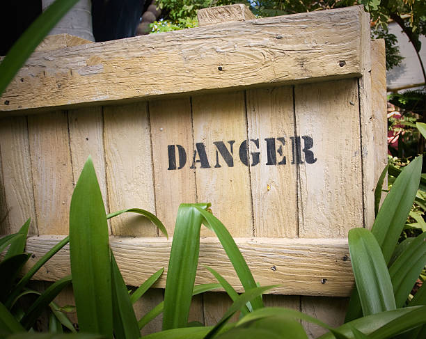 Danger on wooden box stock photo