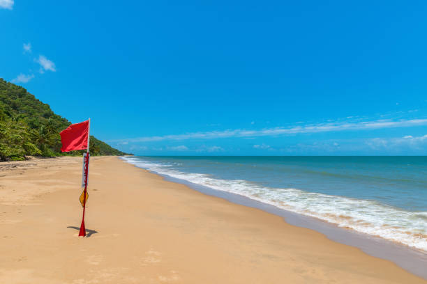 Danger Signal - Red Flag at Ellis Beach, Palm Cove, Queensland, Australia stock photo