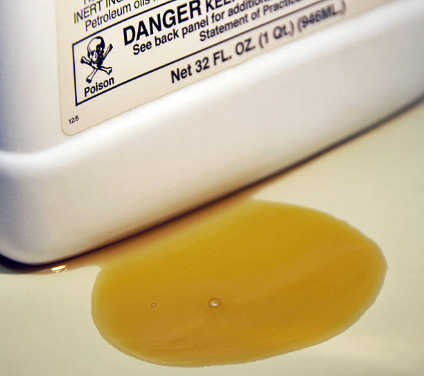 Danger, Spilled Liquid Pesticide  mike cherim stock pictures, royalty-free photos & images