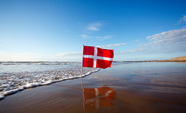 Danish flag at the west coast of Jutland stock photo