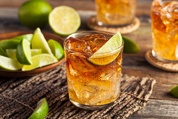 Dark and Stormy Rum Cocktail Dark and Stormy Rum Cocktail with Lime and Ginger Beer rum stock pictures, royalty-free photos & images