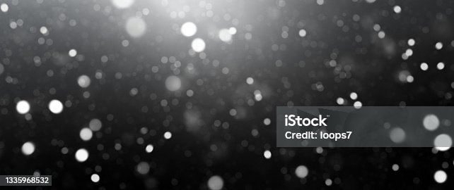 istock Dark Background with Defocused Lights and Dust Particles 1335968532
