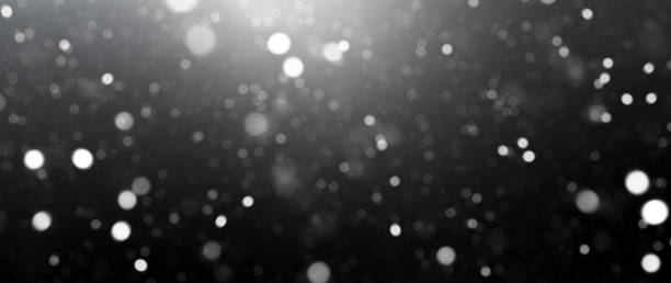 Dark Background with Defocused Lights and Dust Particles stock photo