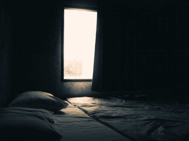 Dark bedroom and window light. stock photo
