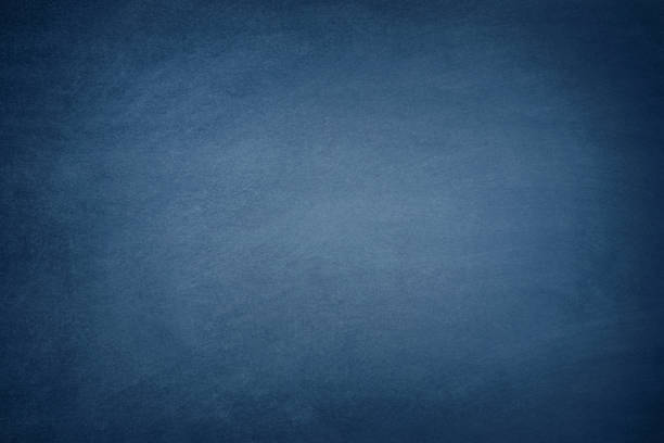 Dark Blue Blackboard Blank blue chalkboard background with traces of erased chalk. writing slate stock pictures, royalty-free photos & images