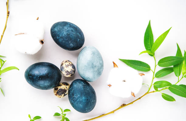 Dark blue Easter eggs on gray background stock photo
