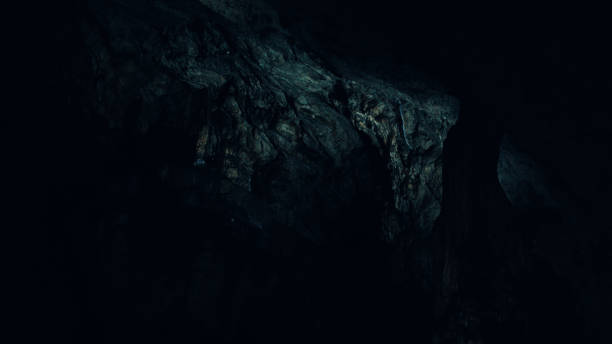 Dark cave stock photo