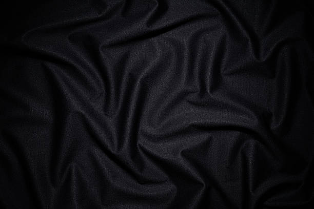 dark fabric texture background with wave pattern - black fabric stockfoto's en -beelden
