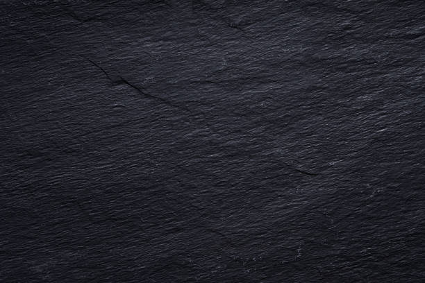 Dark gray black slate background or texture of natural stone. stock photo