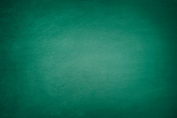 Dark Green Blackboard Blank green chalkboard background with traces of erased chalk writing slate stock pictures, royalty-free photos & images