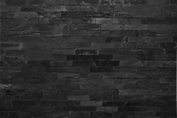 dark grey black brick wall  texture background dark grey black brick wall  texture background asien startblock stock pictures, royalty-free photos & images