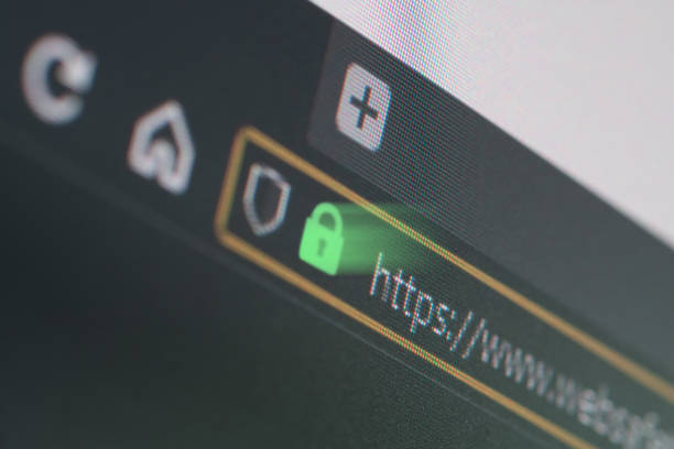 Dark web browser close-up on LCD screen with shallow focus on https padlock stock photo