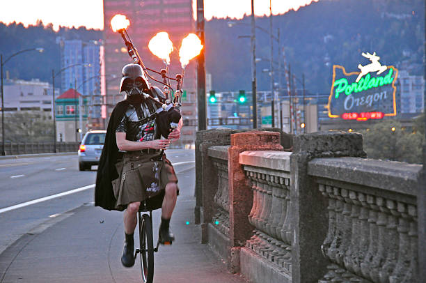 Darth Vader Riding a Unicycle Playing Flaming Bagpipes in Portland stock photo