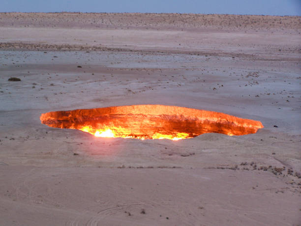 Darvaza Flaming Gas Crater The flaming gas crater at Darvaza in central Turkmenistan. volcanic crater stock pictures, royalty-free photos & images
