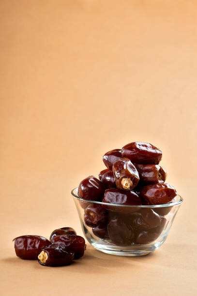 Dates in glass bowl. Dries dates fruit stock photo