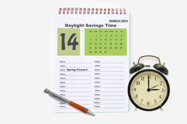 Daylight SAvings Time Daylight Savings March 14 2021 Calendar date book organizer and alarm clock on white background daylight savings 2021 stock pictures, royalty-free photos & images