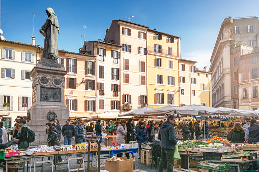 Daytime view of the ancient vegetable market in Piazza Campo de Fiori in Rome. Campo de' Fiori, translated literally from Italian, means 
