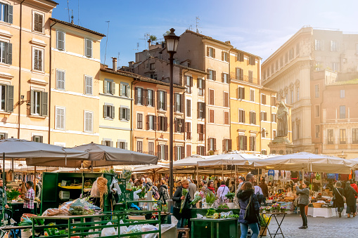 Daytime view of the ancient vegetable market in Piazza Campo de Fiori in Rome. Campo de' Fiori, translated literally from Italian, means 