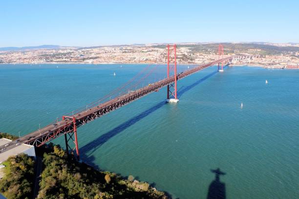 25 de Abril Bridge over the Tagus river, connecting Almada and Lisbon in Portugal stock photo