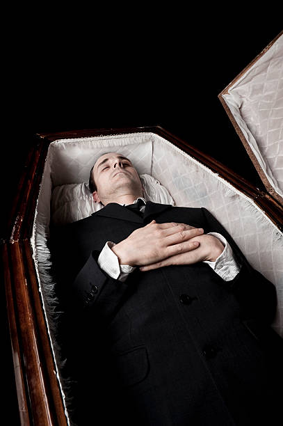 Dead body in a coffin stock photo