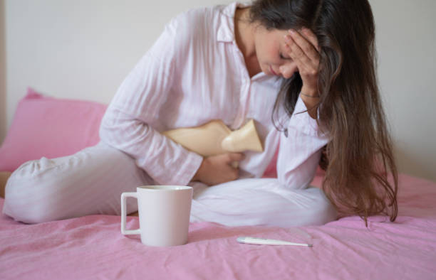Dear uterus, please stop now, killer cramps PMS Dear uterus, please stop now, killer cramps PMS illness pyjama 2019 stock pictures, royalty-free photos & images