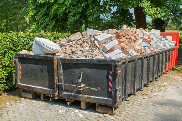 Debris container with stones and toilet stock photo