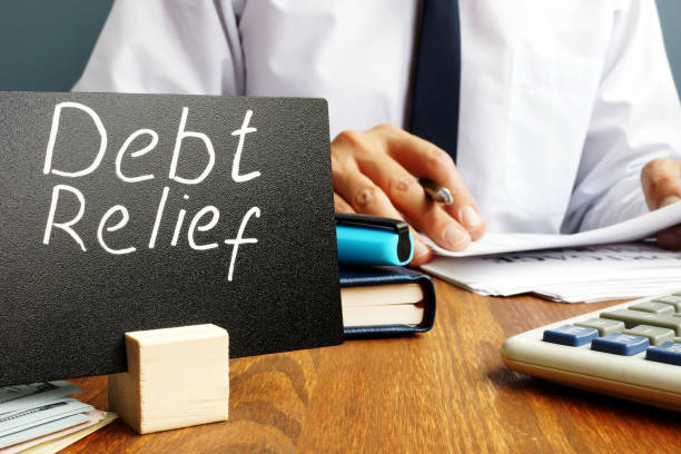 Debt relief sign and manager with documents. Debt relief sign and manager with documents. relief carving stock pictures, royalty-free photos & images