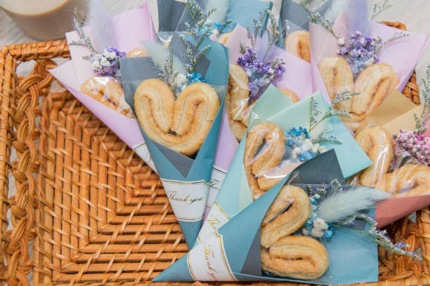 Decorated heart shaped  Butterfly Cracker In the rattan basket stock photo