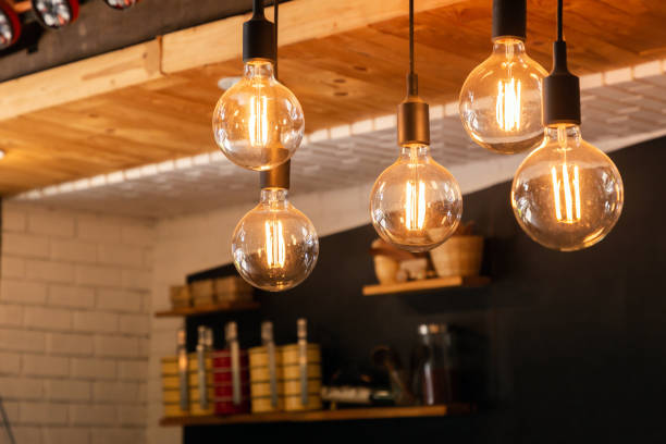 Decorative antique LED tungsten light bulbs hanging on ceiling. Decorative antique LED tungsten light bulbs hanging on ceiling. light bulb filament stock pictures, royalty-free photos & images
