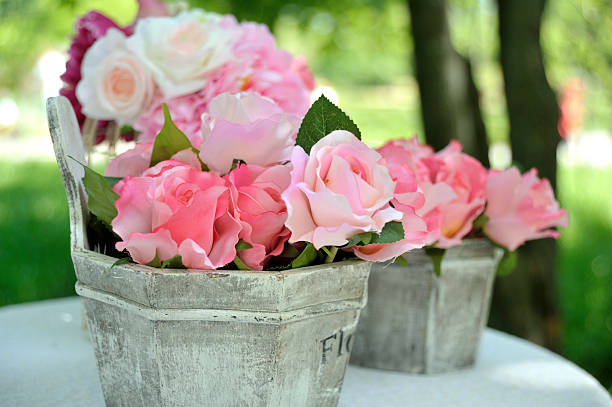 Decorative artificial roses flowers in vase outdoor