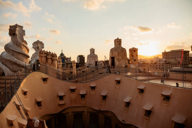 Decorative chimneys on a rooftop of Casa Mila (La Pedrera) during sunset. Barcelona, Spain Rooftop and decorative chimneys of Casa Mila (La Pedrera) - famous building designed by Antonio Gaudi in Barcelona, Spain. casa mil�� stock pictures, royalty-free photos & images
