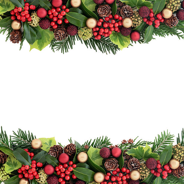 Decorative Christmas Border Christmas background border with red and gold bauble decorations, holly, ivy, pine cones, cedar cypress  and fir leaf sprigs over white with copy space. centerpiece stock pictures, royalty-free photos & images