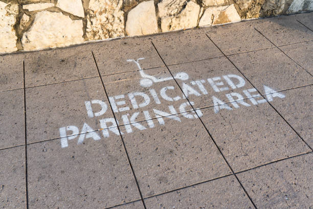 Dedicated Electric Scooter Parking Area Sign on Sidewalk Angle View stock photo