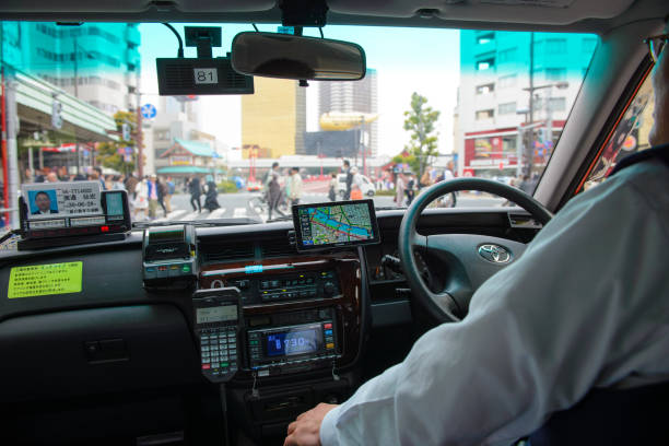 A dedicated taxi driver is doing his job stock photo