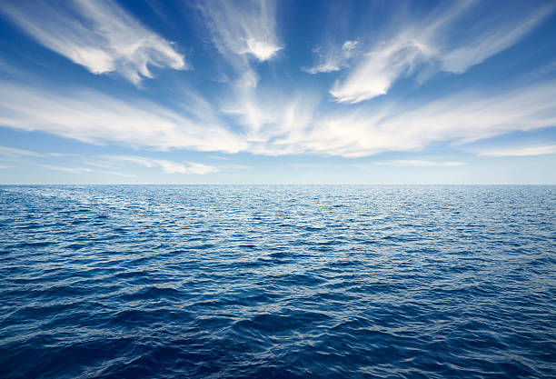 Deep Blue Ocean Deep blue ocean with beautiful sky. horizon over water stock pictures, royalty-free photos & images