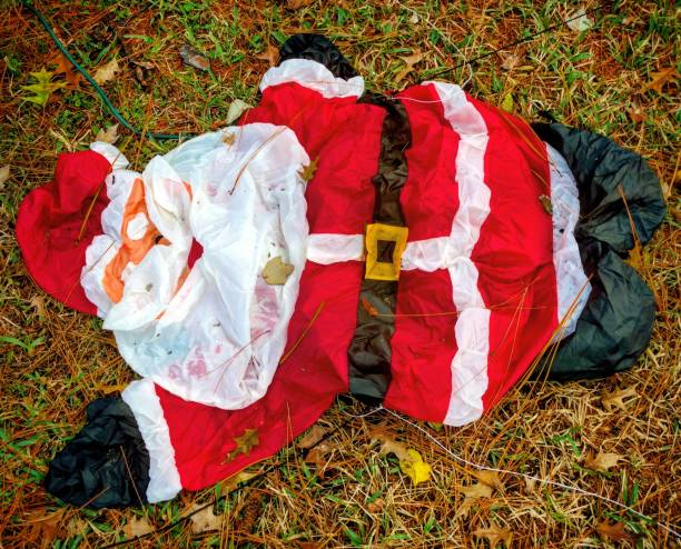 Deflated Santa on the Lawn stock photo