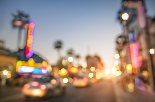 Defocused blur of Hollywood Boulevard at sunset - Bokeh abstract view of world famous Walk of Fame in California - United staes of America wonders - Emotional saturated filter with powered sunshine