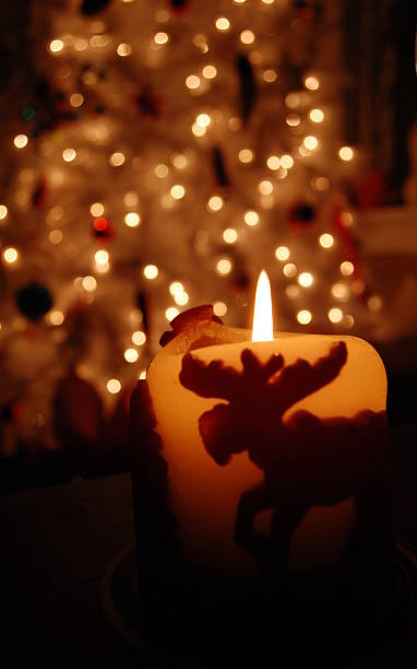 Defocused Christmas Tree and Candle stock photo