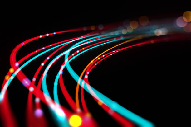 defocused image of  fiber optics lights abstract background - fibra imagens e fotografias de stock