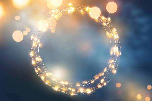 Defocused light background with circular light garland and copy space for your text stock photo