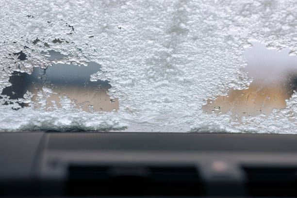 defrosting car windshield stock photo