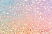 istock Delicate shiny texture, pastel pink and yellow glitter, abstract blurred background 1301362617