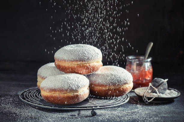 Delicious and sweet donuts with powdered sugar stock photo