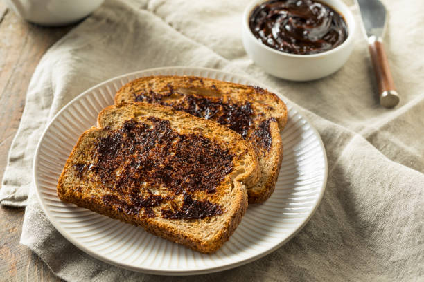 Delicious Australian Dark Yeast Extract Spread Delicious Australian Dark Yeast Extract Spread for Toast toasted bread stock pictures, royalty-free photos & images